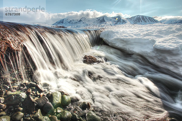 Meltwater creating mini waterfall  along Haines Highway  northern British Columbia