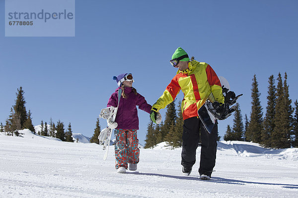 Vereinigte Staaten von Amerika  USA  Landschaftlich schön  landschaftlich reizvoll  Winter  Snowboard  gehen  Menschlicher Vater  Tochter  10-11 Jahre  10 bis 11 Jahre  Colorado  Telluride