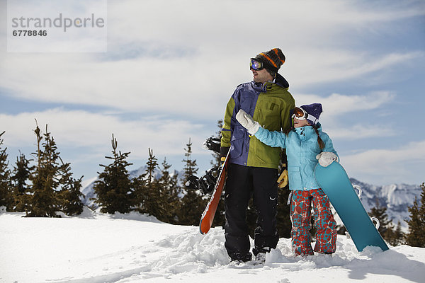 Vereinigte Staaten von Amerika  USA  stehend  Landschaftlich schön  landschaftlich reizvoll  Winter  Snowboard  Menschlicher Vater  Tochter  10-11 Jahre  10 bis 11 Jahre  Colorado  Telluride