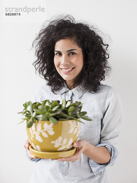 Frau  Schönheit  halten  Pflanze  jung  Blumentopf