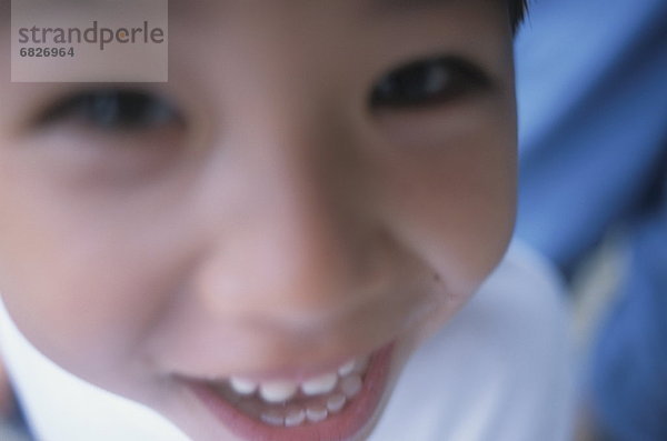 Portrait  sehen  lächeln  Junge - Person  Close-up  close-ups  close up  close ups  Weichzeichner  Blick in die Kamera  Saipan