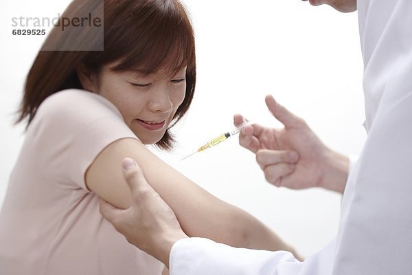 Frau  Arzt  Impfung