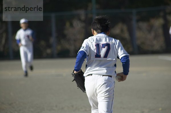 Tiefenschärfe  Teamwork  Junge - Person  rennen  Feld  Baseball