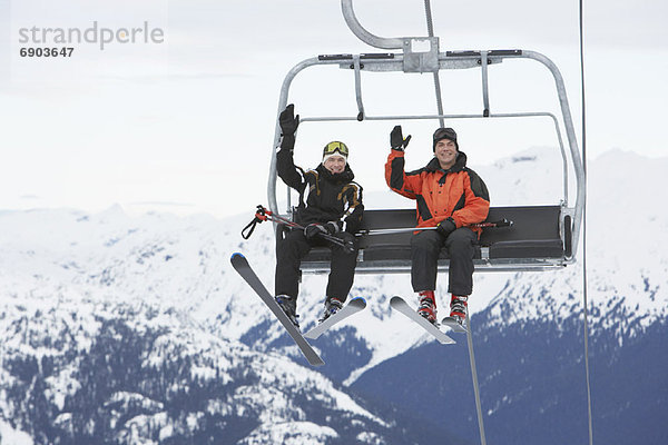 Two Men on Ski Lift  Whistler  BC  Canada