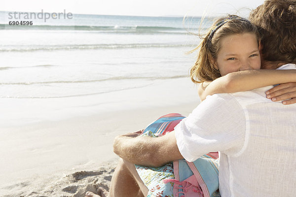 Girl Hugging Father on Beach  Majorca  Spain