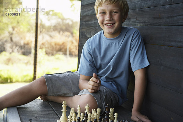 Junge - Person Schach spielen