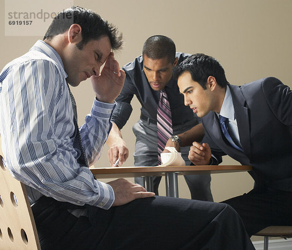 Businessmen in Meeting  Looking Frustrated