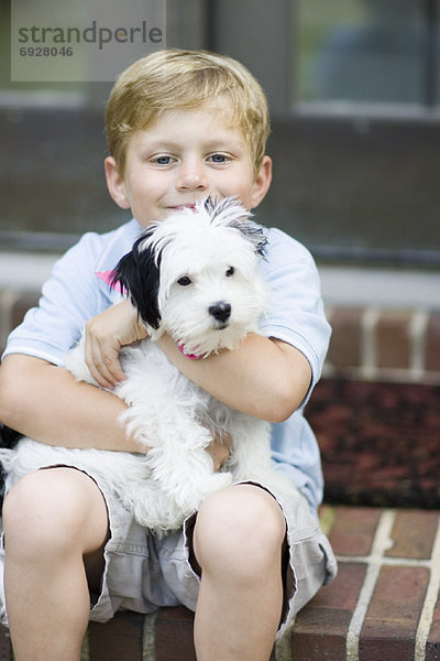Portrait  Junge - Person  halten  Hund