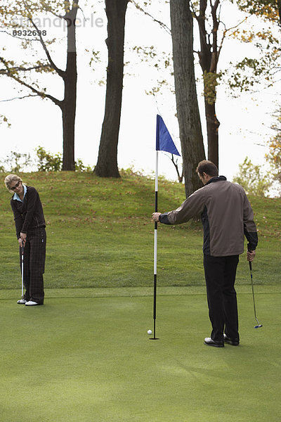 People Golfing