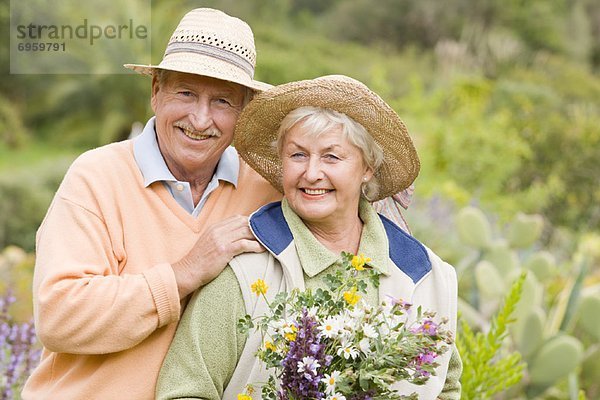 Portrait of Couple  Woman Holding Flowers