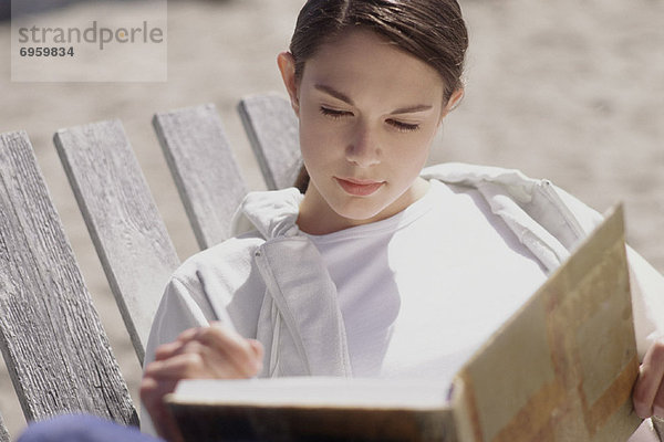 Frau Writing in Journal