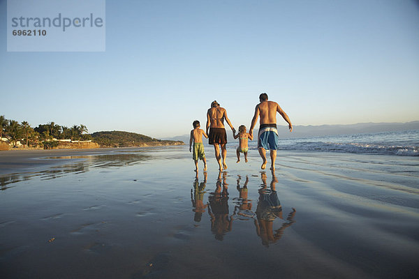 Family Walking on Beach  Mexico