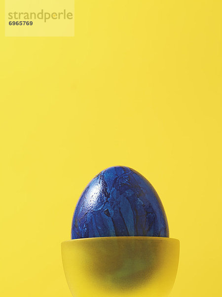 Eierbecher gelb blau Osterei