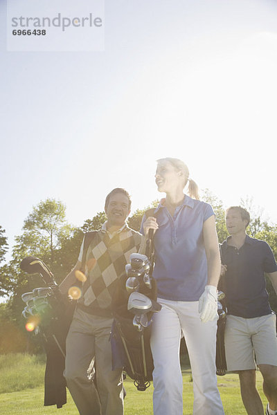 People Golfing