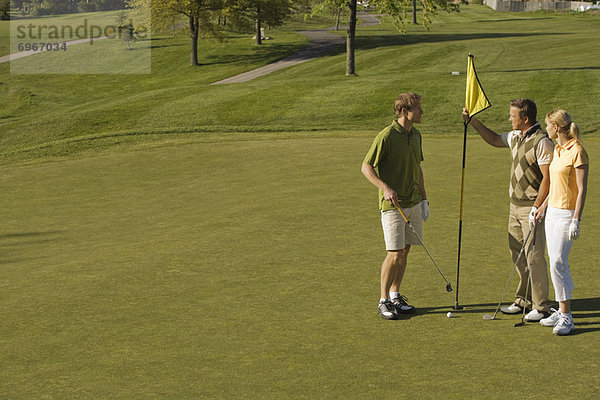 People Golfing