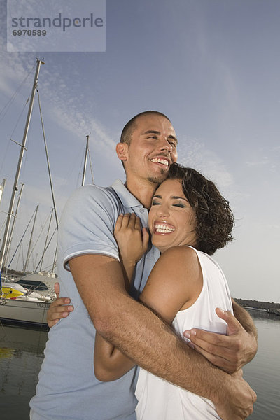 Couple Hugging by Harbor  Rome  Italy