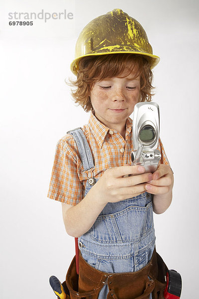Handy  hoch  oben  bauen  benutzen  Junge - Person  arbeiten  Kleidung
