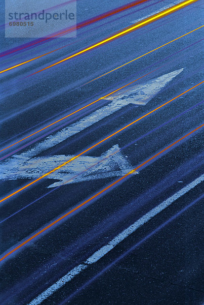 Directional Signs on Road  Tail Light Trails  Transport Abstract
