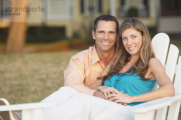 Portrait of Couple  Woman Sitting in Chair