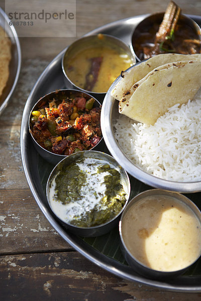 Thali  Kadai Bhindi  Mixed Vegetable Curry  Sambhar  Saag Paneer  Payasam  and Chapati