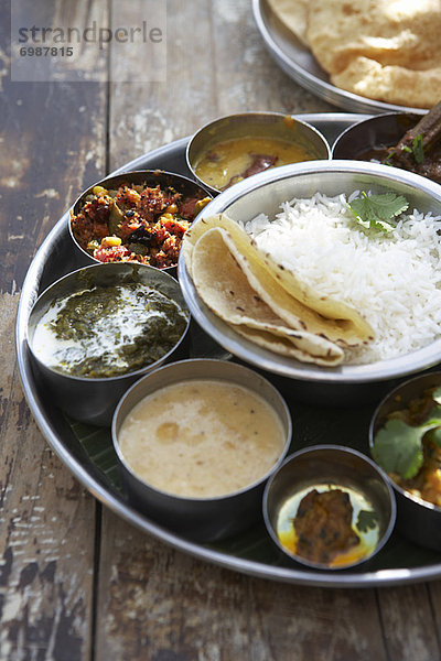 Thali  Kadai Bhindi  Mixed Vegetable Curry  Sambhar  Saag Paneer  Payasam  Mixed Pickle  and Chapati