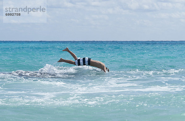 Boy Diving into Water  Playa del Carmen  Yucatan Peninsula  Mexico