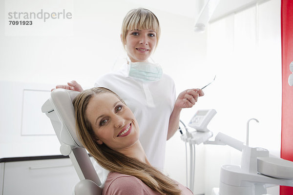 Germany  Dentist and patient  smiling  portrait