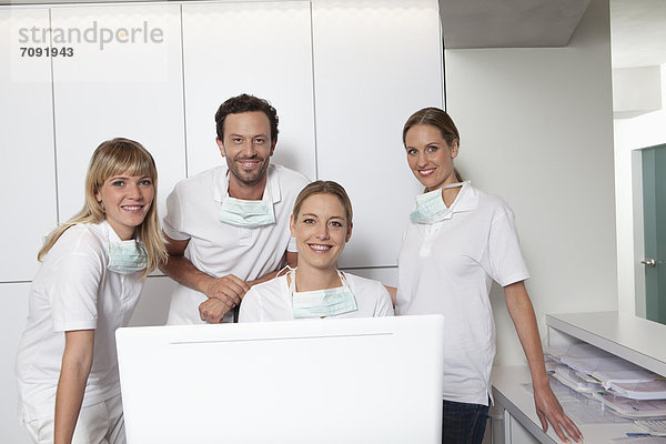 Germany  Dentist and assistance smiling  portrait