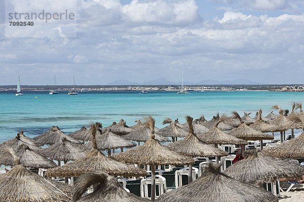 Spain  Mallorca  Straw beach umbrellas at Es Trenc