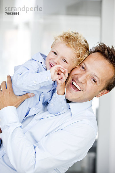 Germany  Father carrying son  smiling  portrait