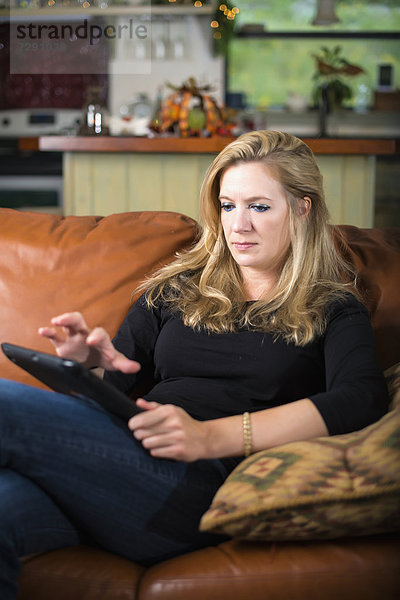 USA  Texas  Mid adult woman using digital tablet