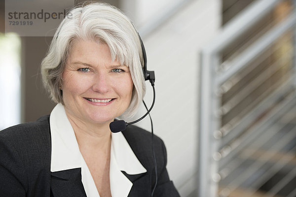 Geschäftsfrau  lächeln  Headset