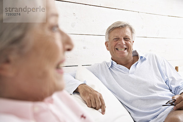 Spain  Senior couple relaxing in hotel  smiling