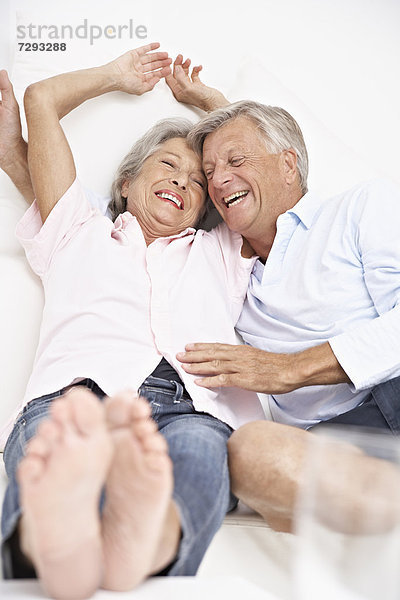 Spain  Senior couple waking up  smiling