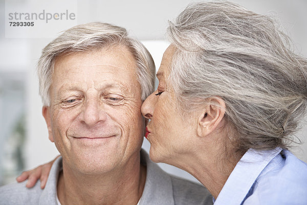 Spain  Senior woman kissing to man  close up