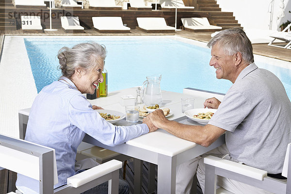 Spain  Senior couple having lunch at Mallorca