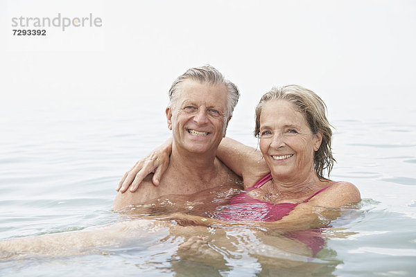 Spain  Senior couple swimming in sea