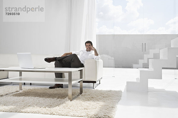 Spain  Businessman relaxing on couch