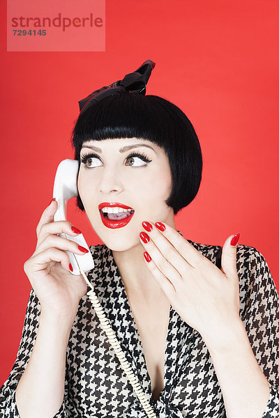 Close up of young woman talking on telephone