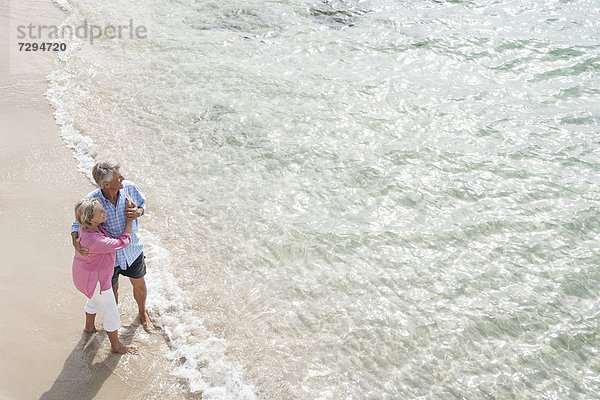 Spain  Senior couple standing beach