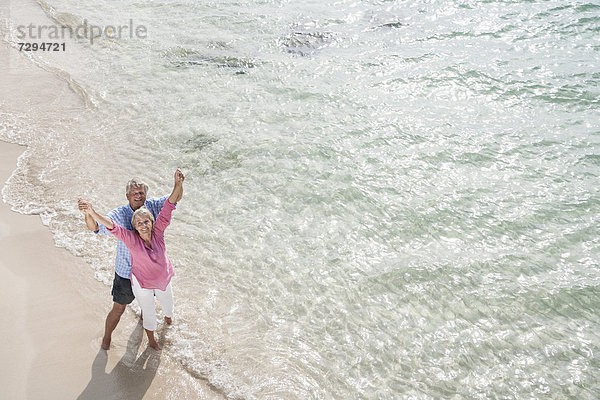 Spain  Senior couple standing on beach
