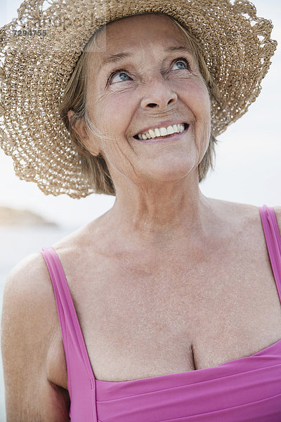 Spain  Senior woman with straw hat  smiling