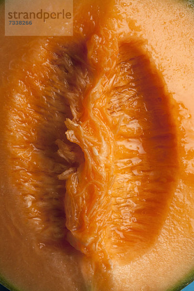 Eine saftige Scheibe Cantaloupe  die an weibliche Genitalien erinnert.