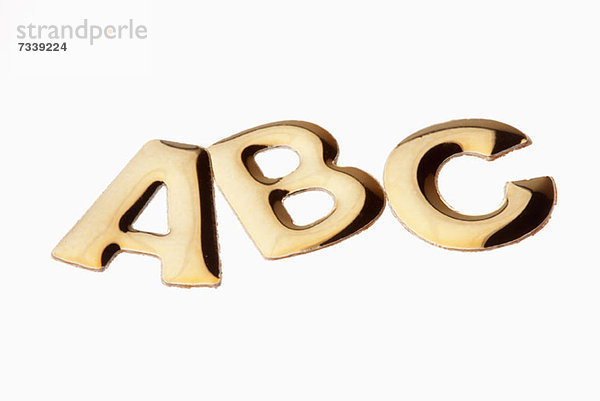 Die Buchstaben'ABC' in goldener Schrift