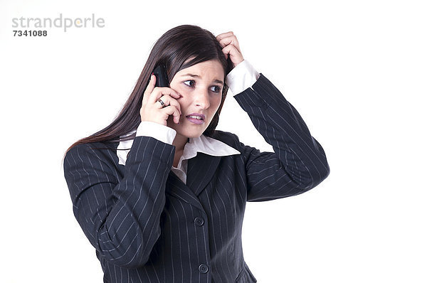 Geschäftsfrau beim Telefonieren  grübelnd  ratlos