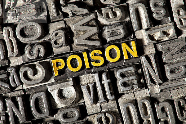 'Alte Bleilettern bilden das englische Wort ''POISON'''