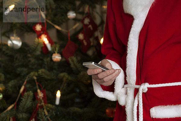 Weihnachtsmann mit dem Handy