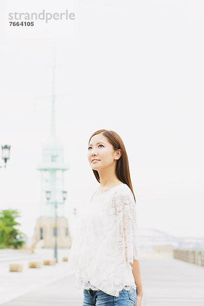 Young woman looking up