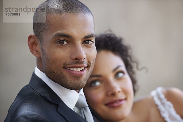 Portrait of newly wed couple  focus on groom