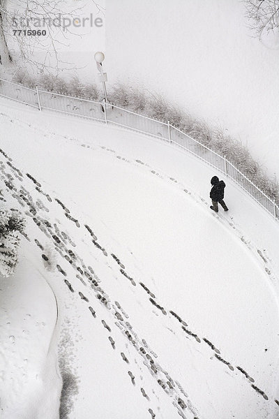 Man walking on fresh snow  toronto ontario canada
